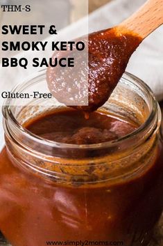 a spoon full of bbq sauce with the words sweet & smoky keto bbq sauce