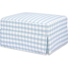 the blue and white gingham checkered ottoman cover is folded over it's sides