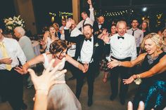 the bride and groom are dancing at their wedding reception