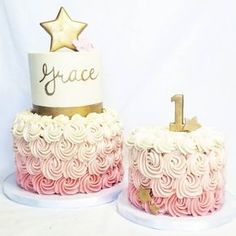 two cakes decorated with pink and white frosting, one has a gold star on top