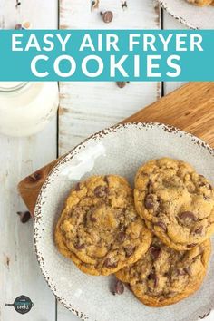 two chocolate chip cookies on a plate with milk in the background and text overlay that reads easy air fryer cookies