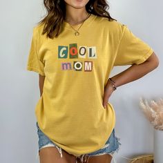 Comfort Colors Mustard Cool Mom Shirt Casual Cotton Shirt With Letter Print, Casual Cotton Shirt With Screen Print, Yellow Short Sleeve Shirt With Letter Print, Yellow Printed Cotton Shirt, Yellow Retro Shirt With Letter Print, Yellow Cotton Tops With Graphic Print, Multicolor Cotton Tops With Letter Print, Yellow Cotton Top With Graphic Print, Retro Yellow Cotton Shirt