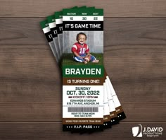 two tickets for a football game with a photo on them and the words, it's game time