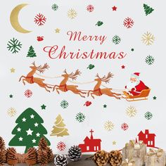 merry christmas wall decals with santa sleigh flying over the village and trees