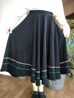 "Vintage black circle flared skirt decorated with yellow and green ric rac trim. Hook and eye on waist skirt. Flared black skirt. M size. Waist 30\"76cm Length 28,5\"72,5cm." Retro Black A-line Skirt, Vintage Black Flared Skirt, Black Retro A-line Skirt, Retro Black Long Skirt, Black A-line Retro Skirt, Retro Black Lined Skirt, God Character, Black Circle Skirt, Skirt With Lace Trim