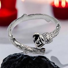 Express your edgy style with our Goth Grunge Tiny Rose with Thorns Silver Finger Wrap Ring. This beautifully crafted minimalist ring features a delicate rosebud and thorn design that wraps gracefully around your finger, inspired by the beauty and strength of nature. Perfect for lovers of gothic, grunge, or nature-inspired jewelry, this floral promise ring symbolizes resilience and love. Its subtle yet bold design makes it a unique accessory for any occasion, blending a tree branch-like structure Silver Goth Rings, Fairy Grunge Ring, Thorn Rings, Thorn Design, Rose With Thorns, Fairy Grunge Jewelry Rings, Thorn Ring, Rose Thorns, Gothic Grunge