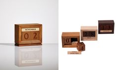 three wooden blocks with numbers on them sitting next to each other in front of a white background