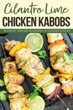 chicken kabobs on a grill with limes and cilantro