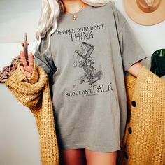 Get ready to be OBSESSED with your new Alice in Wonderland Mad Hatter shirt. It's the cutest and most trendy way to combine all those important trendy dark academia and goblincore vibes! This is the perfect literary shirt!  * Q U I C K * F A C T S * ✺  All shirts are UNISEX ✺  100%  ringspun cotton (fiber content may vary for different colors) ✺  Soft-washed, garment-dyed fabric brings extra coziness ✺  Wash and dry normally (on cool for best results) ✺  Sewn-in twill label * S I Z I N G * ✺ For an oversized fit, select two or three sizes up from your normal size ✺ Model is wearing size L  ✺ Sizing runs true to size ✺ Relaxed fit ✺ Most women find their typical size works best, since they are meant to fit a touch loose ✺ See Size guide and fit in images          * S H I P P I N G * T I M E Hades Und Persephone, Bookish Shirts, Jane Austen Shirts, Distressed Band Tee, Hawthorne House, Literary Shirts, Poet Shirt, Bookish Merch, Band T Shirts