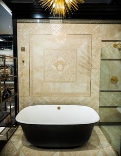 a bath tub sitting in the middle of a bathroom next to a walk in shower