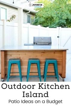 an outdoor kitchen with three blue stools