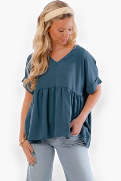 Get ready to elevate your style with our Chants Up Teal Short Sleeve Top ! This Entro Women's Short Sleeve Babydoll Tunic Top is a must-have addition to your wardrobe. The V-neckline and short rolled sleeves give it a trendy and casual look, while the flattering a-line flowy baby doll silhouette adds a touch of elegance and femininity. Made from lightweight 100% polyester, this top is perfect for staying cool and comfortable all day long. Whether you're dressing it up or down, this teal top will Cotton V-neck Solid Color Blouse, Cotton V-neck Blouse In Solid Color, Relaxed Fit V-neck Top For Day Out, Relaxed Fit V-neck Blouse For Day Out, Flowy Cotton V-neck Blouse, Solid Color V-neck Blouse With Relaxed Fit, Flowy Solid Color V-neck Blouse, Solid Color Flowy V-neck Blouse, Flowy Solid V-neck Blouse