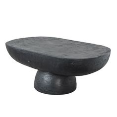 a large black stone object sitting on top of a white background