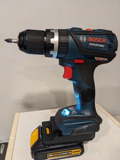 a cordless drill is sitting on a table