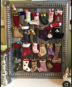 an old frame is filled with christmas stockings and stocking