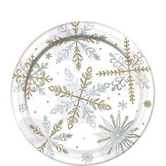 a paper plate with gold and white snowflakes on the rim, set against a white background