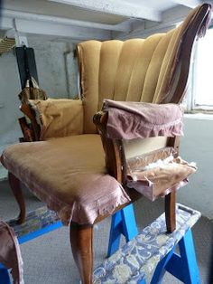 an upholstered chair and footstool are being worked on in a room