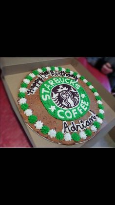 a starbucks cake with green and white frosting