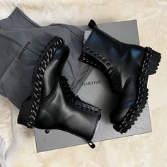 These Are Authentic Balenciaga Combat-Style Boots In Sleek Black Leather. Key Features Include: Smooth Matte Black Leather Upper Lace-Up Front With Silver-Tone Eyelets Chunky Lug Sole With Distinctive Balenciaga Tread Pattern White And Black Rope-Style Detailing Around The Sole Pull Tab At Heel Balenciaga Branding On Sole Size 39 (Eu Sizing) Comes With Original Box And Dust Bag The Boots Are In Excellent, Like-New Condition With No Visible Wear. They Have An Edgy, High-Fashion Look Perfect For A Gotik Style, Balenciaga Branding, Balenciaga Boots, Shoes Balenciaga, Combat Style, High Fashion Looks, Balenciaga Black, Black Rope, Balenciaga Shoes