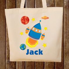 a tote bag with an image of a rocket ship on it and the name jack