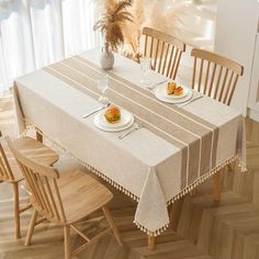 a dining room table with two plates of food on it