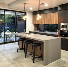 the instagram page on instagram shows an open kitchen and dining area with bar stools