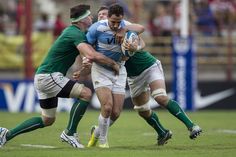 a group of men playing a game of rugby