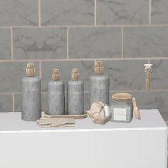 a white counter topped with lots of bottles next to a brick wall and toilet paper