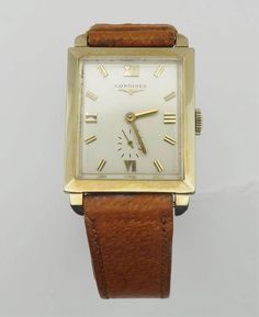 1956 Longines Heavy 14K Solid Gold Case and Strap Buckle Cal 9LT Gentlemen Mechanical Timepiece. Just Serviced, Runs and keeps accurate time, hallmarks on inside/outside case, and buckle, has no scratches either on acrylic glass or case, and the original Cognac tone original leather band have been kept as extra clean, very attractive time piece for a Longines watch lovers. This gorgeous watch will fit a maximum 6 3/4 inches wrist comfortably. Gift or collectors ready. The pictures are part of my item description, please view them carefully and if you have any further questions, feel free to contact us.    ** PLEASE READ THE LISTINGS DESCRIPTION PRIOR TO PURCHASE, FROM HERE ON-OUT, REFUNDS WILL NOT BE ACCEPTABLE DUE TO BUYERS "NOT READING" THE ITEMS DESCRIPTIONS AS WELL AS RUSHING TO PURHCA Rectangular Yellow Gold Watch Accessories For Formal Occasions, Antique Yellow Gold Watches For Business, Vintage Yellow Gold Rectangular Watch, Vintage Rectangular Yellow Gold Watch, Classic Formal Jewelry And Watches With 17 Jewels, Vintage Rectangular Watch With Subdials, Vintage Rectangular Chronometer Watch, Vintage Yellow Gold Rectangular Watch Accessories, Retro Rectangular Watches For Formal Occasions