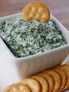 spinach dip with crackers on the side