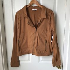 Time And Tru: Dark Tan Cognac Color Moto Jacket. Size Xxl 20. Has Stretch Ribbing On The Side And Sleeves. Made Of 92% Cotton 8% Spandex. The Color Is Called Trailblazer Brown. Brand New With Tag Attached. Comes From A Smoke Free/Pet Free Home See Photos For Measurements Casual Collared Biker Jacket For Work, Casual Collared Biker Jacket For Fall, Casual Collared Brown Biker Jacket, Casual Collared Biker Jacket For Spring, Casual Brown Biker Jacket With Zipper Closure, Casual Brown Biker Jacket With Zipper, Tan Denim Jacket, Comfy Jackets, Biker Denim