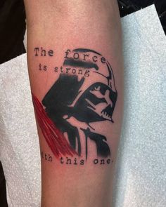 a star wars tattoo with darth vader saying the force is strong