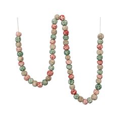 the beaded necklace is hanging from a hook on a white background, with red and green beads