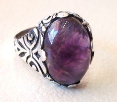 amethyst agate natural stone sterling silver 925 man ring vintage arabic turkish ottoman style jewelry oval purple gem all sizes bronze Risk free Quality guarantee policy : If you are not satisfied with your item for any reason simply send it to us and you will get a replacement or refund . please write your size with the order and we will size it for you . Our ring is handcrafted mostly with a few simple tools . but some methods are used in casting like lost wax method . sterling silver 925 is Fine Jewelry Amethyst Cabochon, Vintage Amethyst Jewelry With Polished Finish, Fine Jewelry Amethyst Oval Cabochon, Antique Oval Jewelry With Natural Stones, Antique Round Amethyst Jewelry, Antique Jewelry With Large Round Stone, Elegant Oval Amethyst Ring With Natural Stones, Silver Amethyst Ring With Oval Cabochon Gemstone, Handmade Oval Amethyst Jewelry