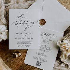 the wedding stationery is laid out on top of an envelope with a wax stamp