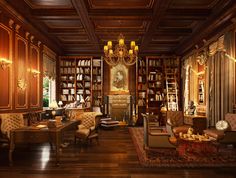 a large library with many bookshelves and couches in front of a chandelier