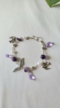 Lilac Charm Bracelet is made from amethyst beads, amethyst chips, glass beads, pewter charms, and tarnish-resistant silver plated copper wire. Everything is handmade by me ♡  Feel free to send me a message if you want custom sizing Let me know your ring size for accurate sizing on free gift! Amethyst Beads, Cute Bracelets, Hand Jewelry, Phone Charm, Star Charms, Cute Jewelry, Charm Bracelets, Copper Wire, Lilac