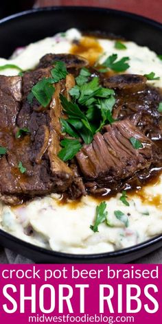 a close up of a plate of food with meat and mashed potatoes on it