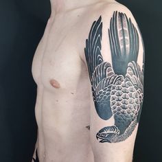 a man with an eagle tattoo on his arm