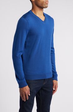 The only thing more wonderful than a smooth and polished-looking merino wool sweater is the fact that it's washable—your life just got easier! 28" length (size Medium) V-neck Ribbed cuffs and hem 100% merino wool Machine wash, dry flat Imported Men's Clothing Blue V-neck Fine Knit Sweater, Blue Cashmere V-neck Sweater, Blue V-neck Cashmere Sweater, Classic Blue V-neck Sweater, Blue Merino Wool Fine Knit Sweater, Blue Fine Knit Merino Wool Sweater, Classic Blue V-neck Sweater For Fall, Classic Blue V-neck Sweater For Work, Blue Fine Knit V-neck Sweater