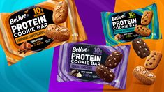 three bags of protein bars and one bag of cookie bar on an orange, purple, and blue background