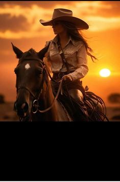 a woman riding on the back of a brown horse at sun sets in the background