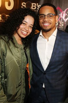 a man and woman standing next to each other