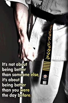 a man in white shirt and black belt with words on it that say it's not about being better than someone else, it's about being better