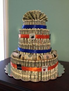 a cake made out of money sitting on top of a table