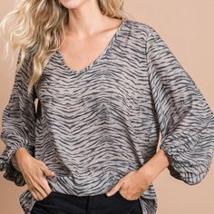 Bella Zebra Blouse Sophisticated And Stylish! This V Neck, Light Weight, Balloon Sleeve Blouse Looks Great Dressed Up With Nice Pants Or Jeans. Wear It Alone Or Under A Blazer Or Cardigan. Fits True To Size For A Relaxed Fit. Colors: Grey And Light Mocha Fabric: Polyester Chic Zebra Print Blouse, Chic Gray V-neck Blouse, Gray V-neck Blouse For Work, Gray V-neck Blouse For Workwear, Black Zebra Print Top For Workwear, Spring Zebra Print V-neck Top, Cardigan Fits, Nice Pants, Balloon Sleeve Blouse