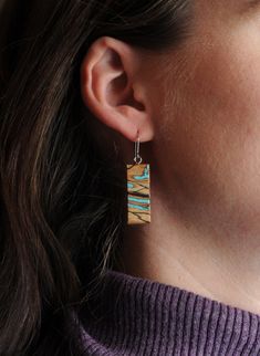 These modern rectangle bar earrings are handcrafted from natural sugar Maple with a organic abstract spalting, inlaid with genuine Turquoise chips. Finished with hypoallergenic surgical steel or sterling silver findings. Hypoallergenic, very lightweight, and tarnish resistant. These earrings are sold as one pair and each one will have slight variations in the woodgrain/pattern, tone, and shape of the inlay, please see all of the photos to get an idea of the variations you might receive. I am happy to send photos of some available pair if you message me. Each piece is hand cut and inlayed by Josiah Eidmann in Kenosha, WI. Blue Inlay Earrings For Gift, Blue Inlay Earrings For Gifts, Turquoise Inlay Earrings Gift, Turquoise Inlay Earrings As Gift, Unique Blue Inlay Earrings, Unique Blue Earrings With Inlay, Woodgrain Pattern, Organic Abstract, Spalted Maple