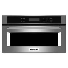 a microwave oven with the door open and electronic controls on it's side, in stainless steel