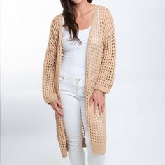 Beat the chill in style with the Enya Long Crochet Cardigan. Featuring a trendy neutral sepia tone with an open crochet detail, this cardigan is easy to wear and certain to become your spring go-to. This long sleeve sweater is perfect for your Spring and Summer wardrobe, throw over your favorite top with a pair of leggings or skinny jeans with some sandals and necklace for a classic look! This top is a light weight sweater, it will give you enough warmth and comfort in a cool day without looking Open Knit Cardigan For Layering, Lightweight Open Front Cardigan For Layering, Trendy Pointelle Knit Outerwear For Layering, Open Front Open Knit Cardigan For Layering, Trendy Open Front Open Knit Sweater, Trendy Open Front Sweater With Open Knit, Trendy Open Knit Outerwear, Lightweight Winter Cardigan For Layering, Casual Open Knit Cardigan For Layering