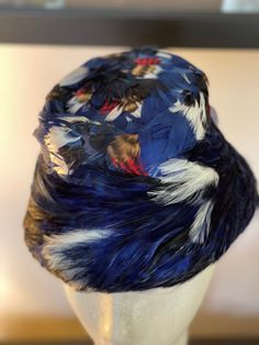 "Vintage Blue/White/Red Feather Pillbox Hat Union Made. Inner circumference: 21\" The hat has a tag sewn on the inside which indicates it's Union made (see pic). There is also a small tear on the inside that is not visible on the outside (see pic). The United Hatters, Cap and Millinery Workers International Union (1934-1983), also known by acronyms including UHCMW, U.H.C. & M.W.I.U. and UHC & MWIU,[1] was a 20th-century American labor union" Blue Cloche Hat With Curved Brim, Adjustable Blue Cloche Hat With Flat Brim, Adjustable Blue Cloche Cap, Blue Flat Brim Bucket Hat One Size, Blue Flat Brim Bucket Hat, White Pillbox Hat, Feather Hats, Halloween Costume Wedding, Pearl Tea